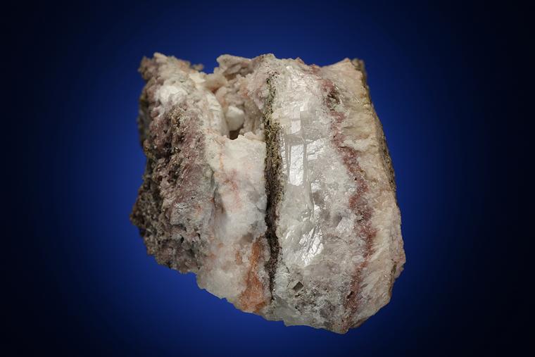 NATROLITE with PREHNITE, ANALCIME and COPPER in CALCITE